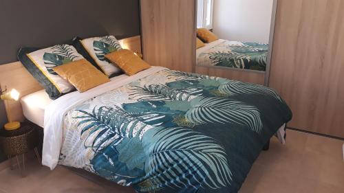 a bedroom with a bed with a zebra patterned blanket at HAPPY HoMe For You in Lunel