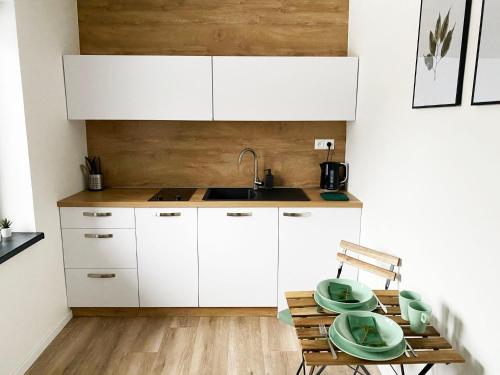 A kitchen or kitchenette at Apartmány Elli