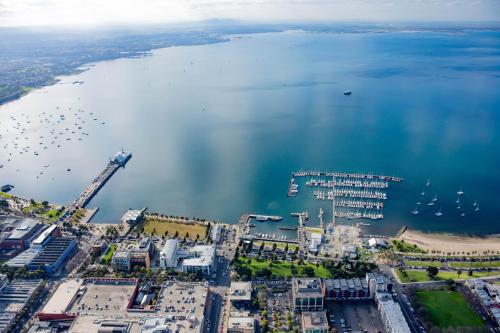 an aerial view of a harbor with boats in the water at Oaks R Suites Geelong in Geelong