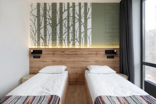 Postel nebo postele na pokoji v ubytování Baza Smart Hotel
