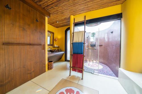a bathroom with a shower with a glass door at Paradee in Ko Samed