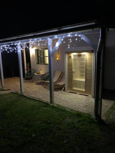 a patio with lights on it at night at Smaragd in Doba