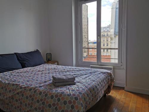 Ένα ή περισσότερα κρεβάτια σε δωμάτιο στο Lovely Flat in Paris - City center - Nation-Picpus