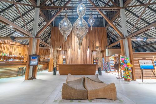 a large room with wooden walls and wooden furniture at Ao Prao Resort in Ko Samed