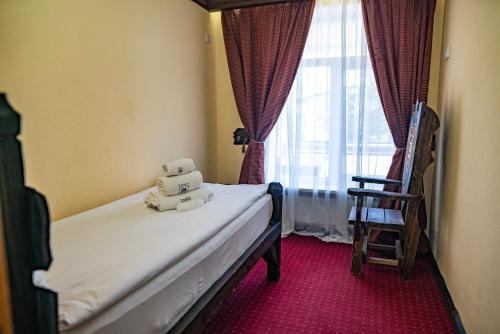 Ένα ή περισσότερα κρεβάτια σε δωμάτιο στο Dniprovskiy Dvir