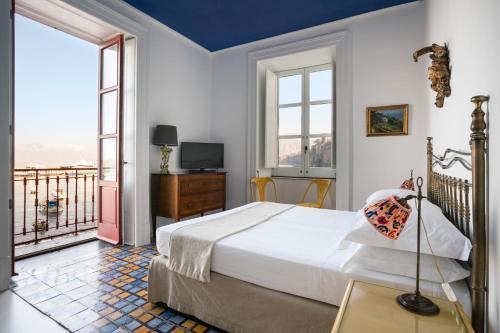 מיטה או מיטות בחדר ב-Marina Piccola 73