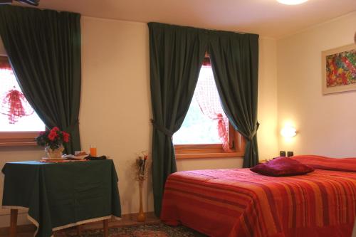 Postel nebo postele na pokoji v ubytování Hotel La Colombina