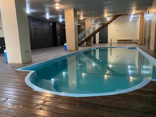 a pool in the middle of a building at Miramar Ski - your home away from home - in Sierra Nevada