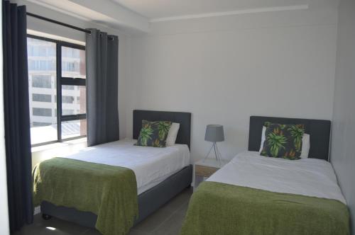 Tempat tidur dalam kamar di Accommodation Front - Stunning 4 Sleeper Near Ushaka Marine World