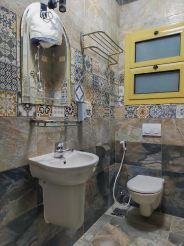 a bathroom with a sink and a toilet at Geo Palace in Dahab