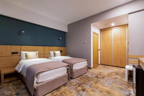 GRAND VIEW Hotel & Suites Copouにあるベッド