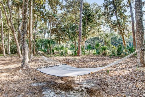 a hammock in a forest with trees at Seabrook Island Geataway in Seabrook Island