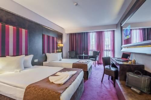 Postel nebo postele na pokoji v ubytování Best Boutique Hotel