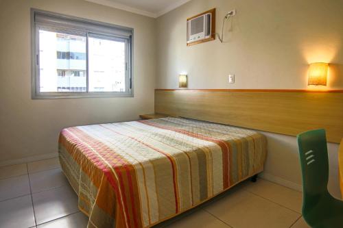 Postel nebo postele na pokoji v ubytování A Furninha Suites