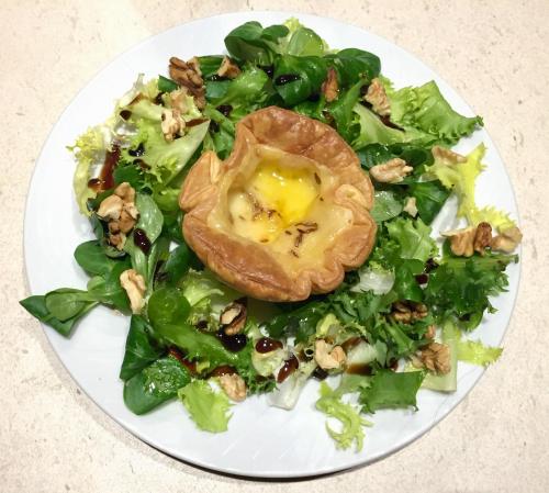 a white plate with a salad with an egg on it at L'ESCALE COTE BLEUE B&B AND Spa in Sausset-les-Pins