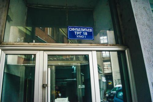 a sign above the entrance to a building at Aparment Theatre in Niš
