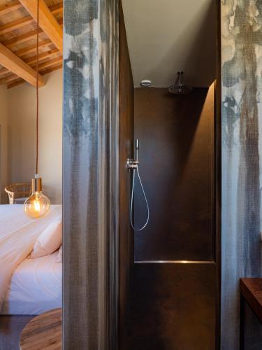 a door leading into a bedroom with a bed at Casale Tre Gelsi in Cingoli