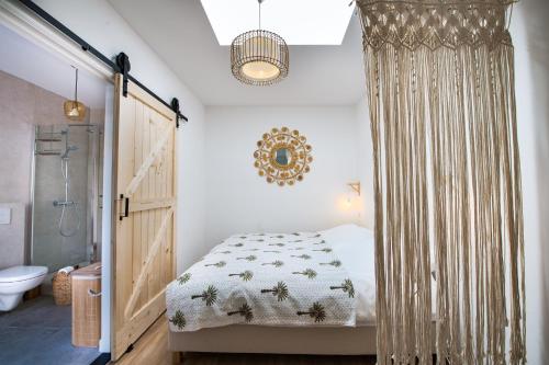 Кровать или кровати в номере Sea Cottage Zandvoort