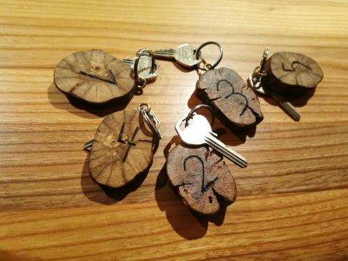 a group of four key chains on a table at Weingut Assigal in Leibnitz