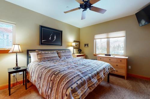 a bedroom with a bed and a ceiling fan at Beautiful East Vail 3 Bedroom Condo w/Hot Tub On shuttle Route. in Vail