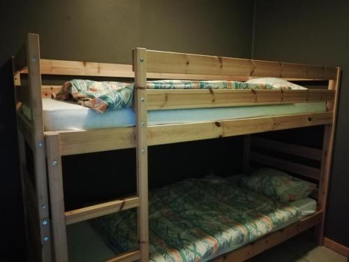 a couple of bunk beds in a room at Hotel Dry Les Courtis in Robertville