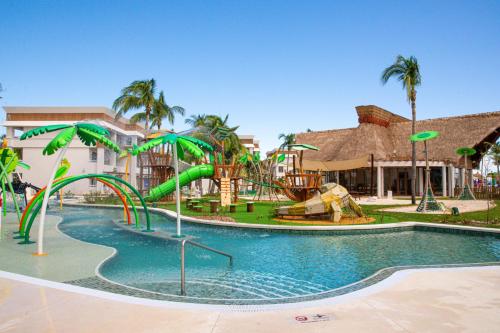 a water park with a slide and slides at Bahia Principe Grand Tulum - All Inclusive in Akumal