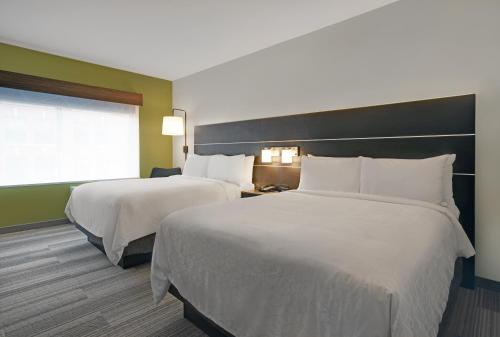 a hotel room with two beds and a window at Holiday Inn Express - Milwaukee Downtown by IHG in Milwaukee