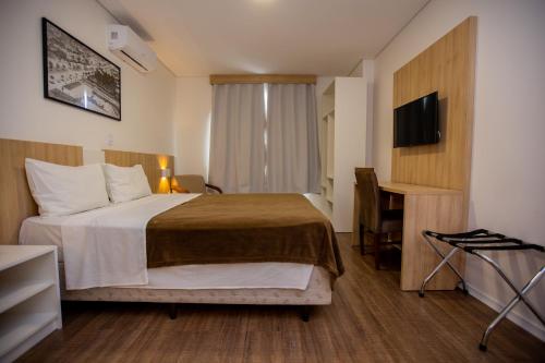 Tri Hotel Chapecóにあるベッド