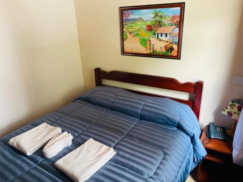 Katil atau katil-katil dalam bilik di Apto Econômico