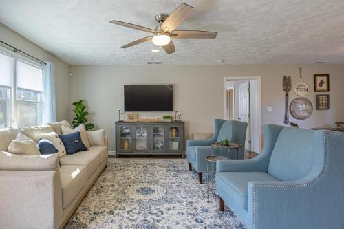 a living room with a couch and two chairs and a tv at Ranch Style Home & Plenty Of BKYD Space Near KSU in Marietta