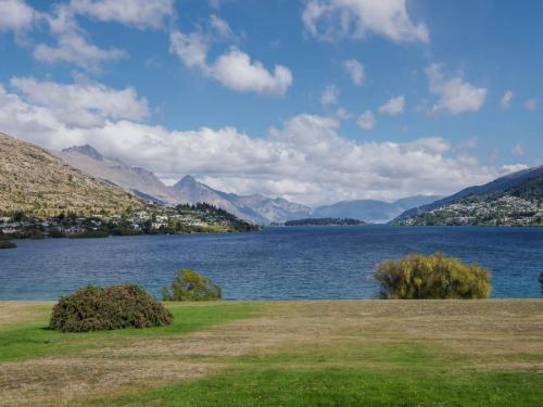 a view of a lake with mountains in the background at Lake Avenue Studio in Queenstown