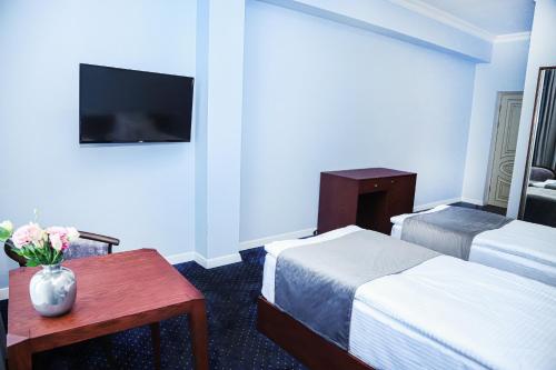 Grand Fortune Hotelにあるテレビまたはエンターテインメントセンター