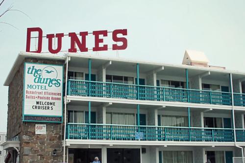 a hotel with a dunes sign in front of it at Dunes Court in Ocean City