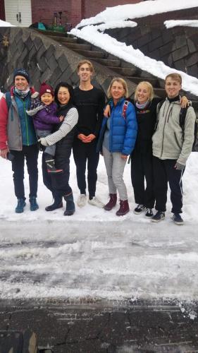 a group of people posing for a picture in the snow at Do Sports Plaza Madarao in Iiyama