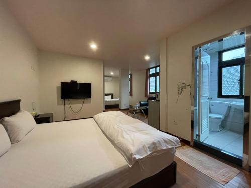Postel nebo postele na pokoji v ubytování Da Fang Hotel