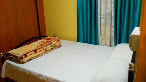 Postel nebo postele na pokoji v ubytování Backpackers Hostel
