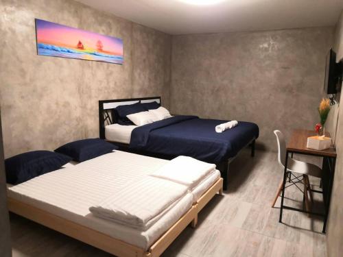 Postel nebo postele na pokoji v ubytování Phooree Boutique Hotel