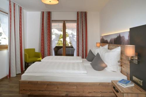 Ein Bett oder Betten in einem Zimmer der Unterkunft Gästehaus Sonnenhang