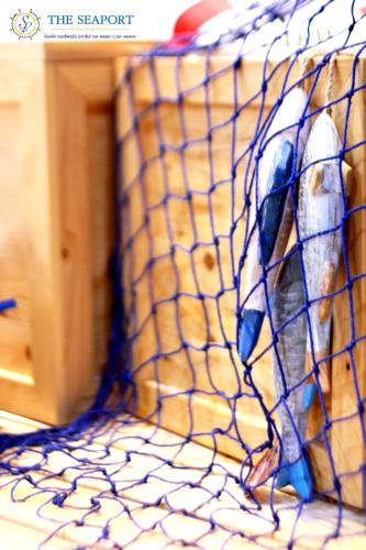 a picture of a fish in a net at THE SEAPORT Hotel โรงแรมเดอะซีพอร์ต in Samut Sakhon