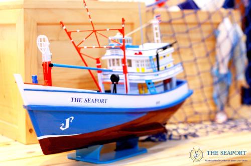 a toy boat is sitting on a table at THE SEAPORT Hotel โรงแรมเดอะซีพอร์ต in Samut Sakhon