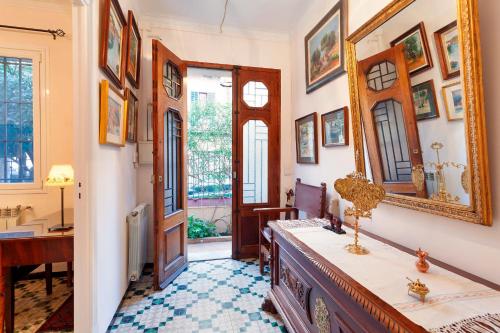 a home office with a desk and a mirror at Can Duran in Palma de Mallorca