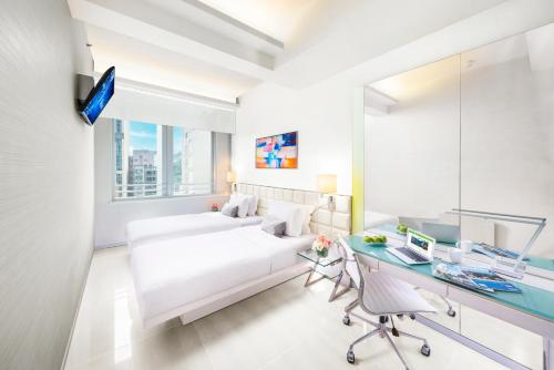 Letto o letti in una camera di iclub Wan Chai Hotel