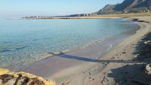 a view of a beach with the sand and water at B&B La mia Isola in Castelluzzo