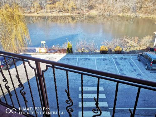 a view of a parking lot next to a river at Ribkata Family Hotel in Smolyan