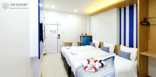 Postel nebo postele na pokoji v ubytování THE SEAPORT Hotel โรงแรมเดอะซีพอร์ต