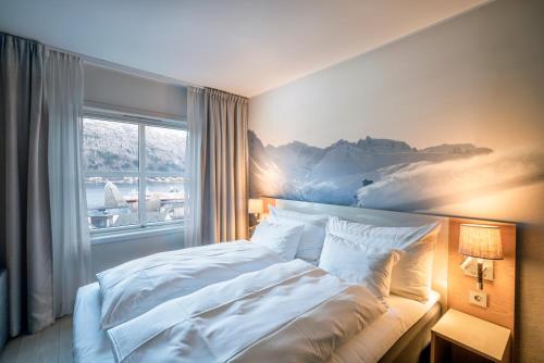 Ένα ή περισσότερα κρεβάτια σε δωμάτιο στο Grand Hotel - by Classic Norway Hotels