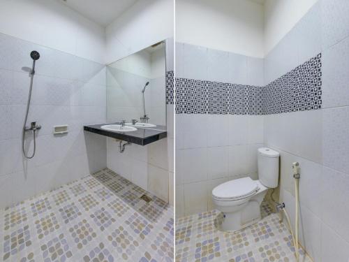 Ванная комната в Super OYO 4010 Zaara Guest House Syariah