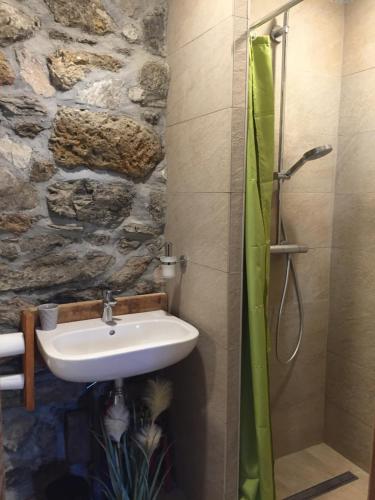 a bathroom with a sink and a shower at La Lauze village house in Clarée Valley 4P in Val-des-Prés