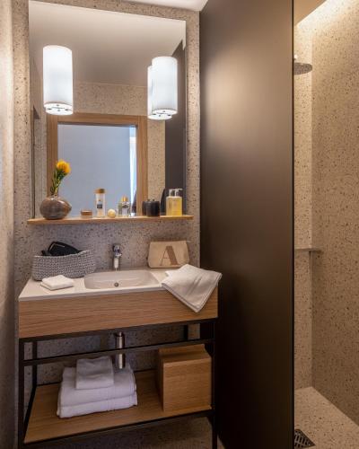 a bathroom with a sink and a mirror at OneBavariaHomes in Munich