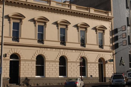 a large building with a clock on the front of it at Quality Inn Heritage on Lydiard in Ballarat